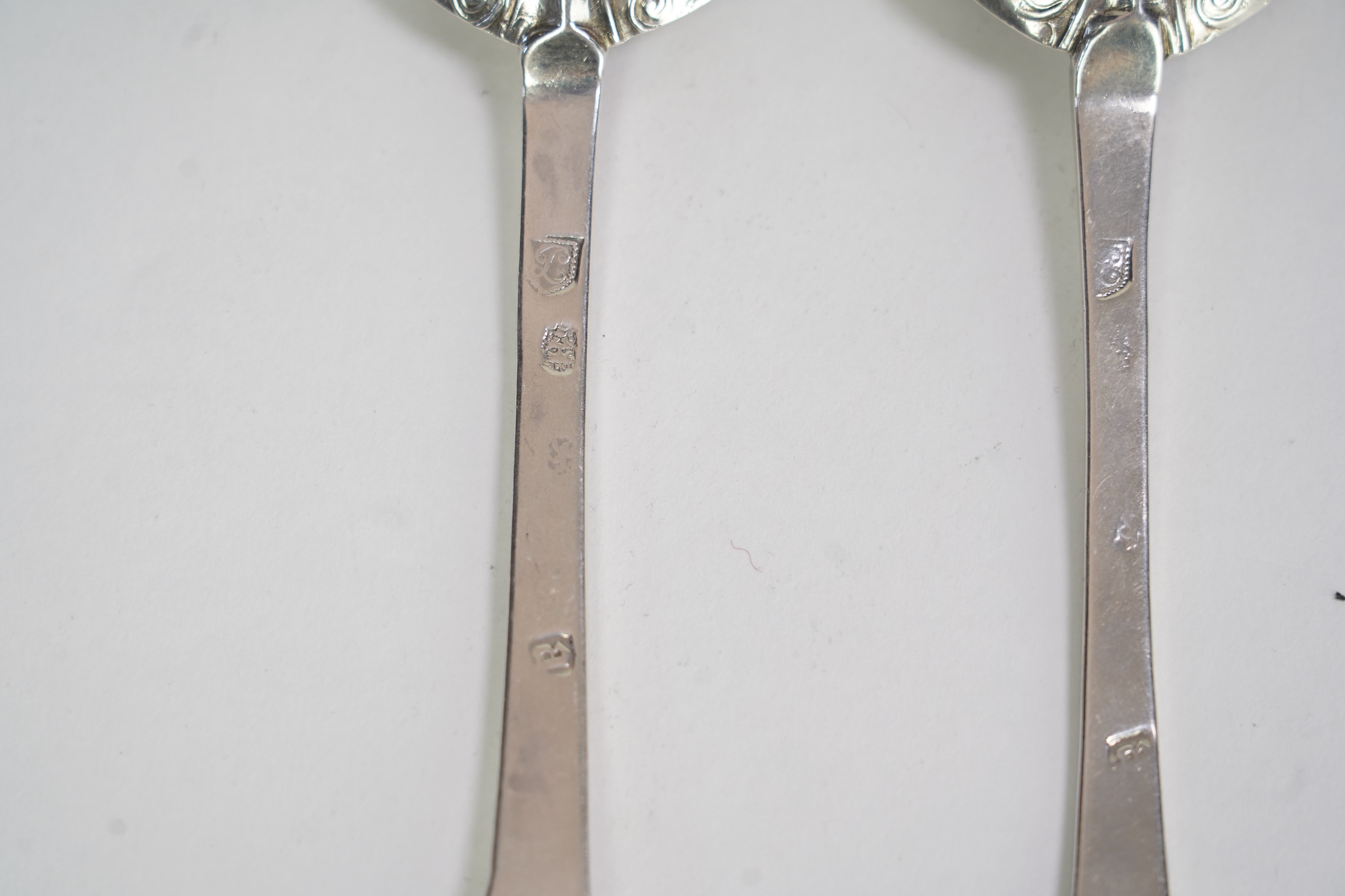 A pair of Charles II silver lace back trefid spoons, maker PL (Jackson's ref. p.137)